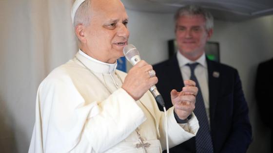 Pope Leo XIV (L) speaks to journalists aboard the papal flight from Malabo, Equatorial Guinea to Rome, Italy, 23 April 2026, at the end of his 11-day apostolic journey to Africa.